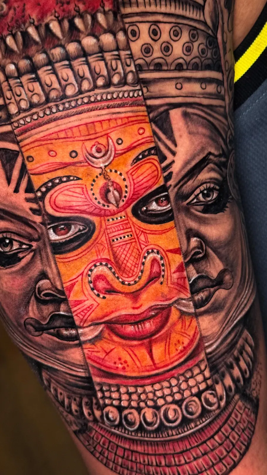 Kathakali face in colour realism, split with black and grey portraits, by Aswa Tattoo, Calicut