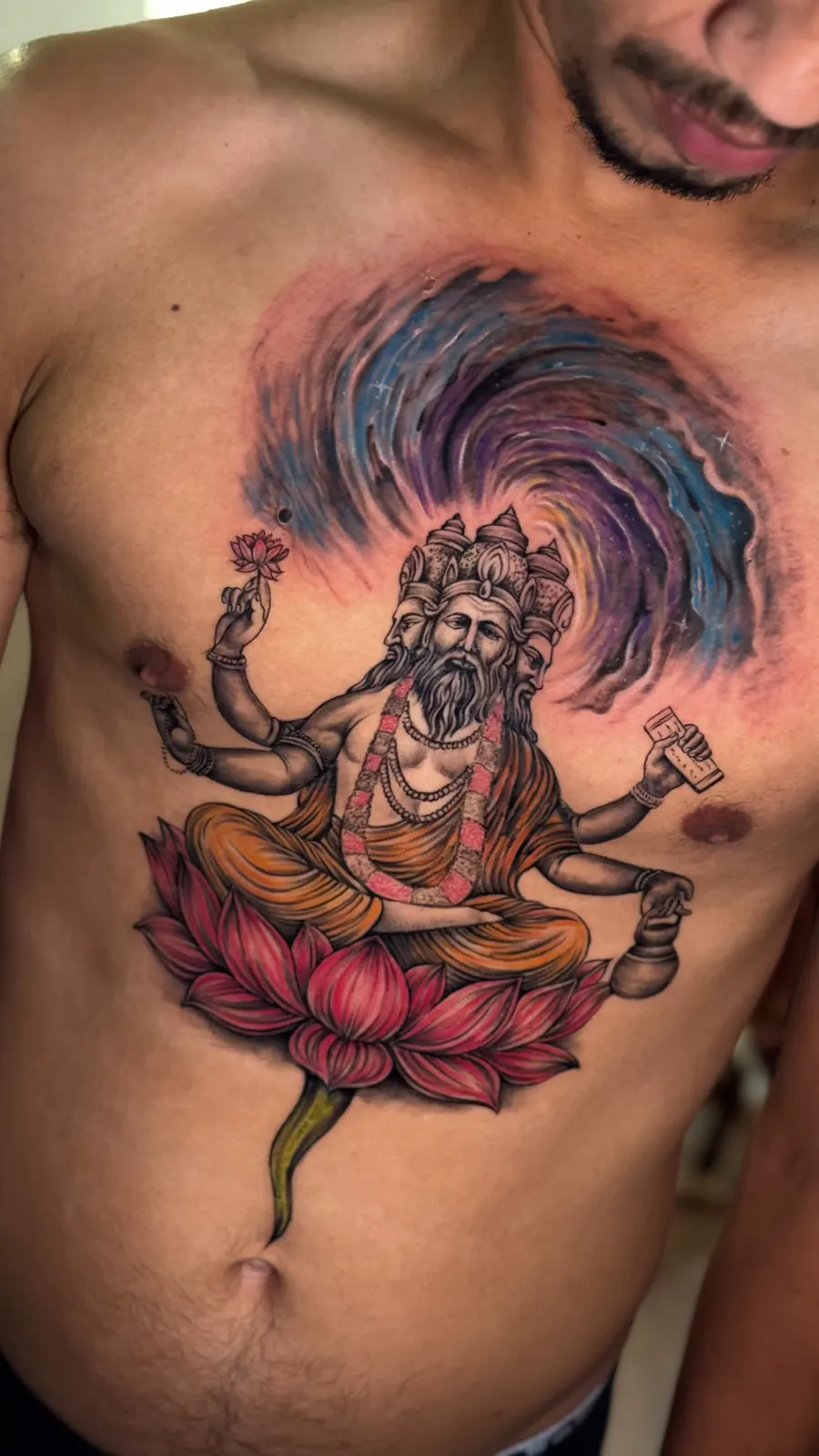 Vishnu colour tattoo on the chest by Aswa Tattoo